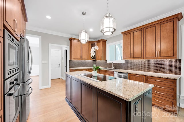 12711 Duncourtney Ln, Charlotte, NC 28277 - kitchen with stainless steel appliances, a sink, tasteful backsplash, a center island, and light wood-style floors