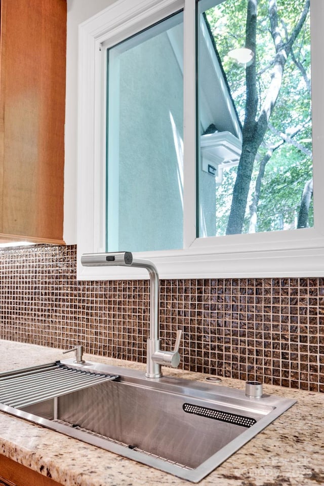 12711 Duncourtney Ln, Charlotte, NC 28277 - kitchen view of a sink, tasteful backsplash, and light stone countertops