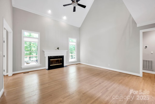 12711 Duncourtney Ln, Charlotte, NC 28277 - unfurnished living room featuring high vaulted ceiling, healthy amount of natural light, ornamental molding, a premium fireplace, and a ceiling fan