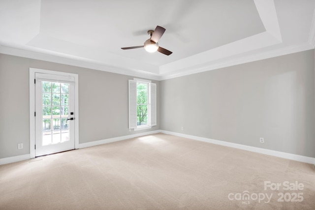 12711 Duncourtney Ln, Charlotte, NC 28277 - spare room with a raised ceiling, a ceiling fan, light colored carpet, crown molding, and baseboards