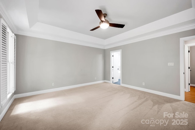 12711 Duncourtney Ln, Charlotte, NC 28277 - unfurnished bedroom with a tray ceiling, light colored carpet, baseboards, ornamental molding, and ceiling fan
