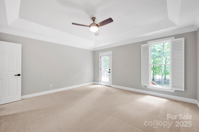 12711 Duncourtney Ln, Charlotte, NC 28277 - carpeted empty room featuring a tray ceiling, ceiling fan, baseboards, and crown molding