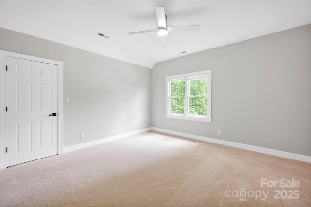 12711 Duncourtney Ln, Charlotte, NC 28277 - spare room with light carpet, ceiling fan, baseboards, and vaulted ceiling