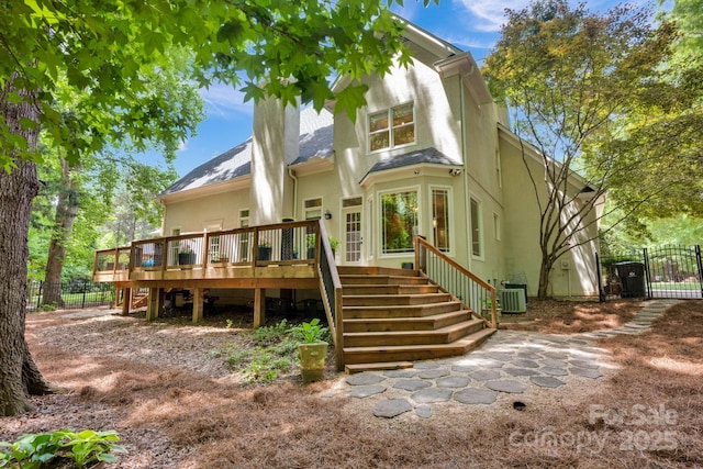 12711 Duncourtney Ln, Charlotte, NC 28277 - back of house featuring stairway, a wooden deck, a gate, a shingled roof, and central AC