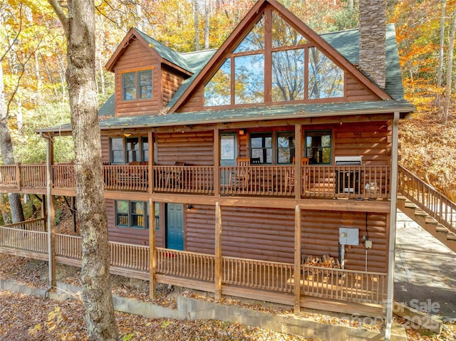 339 Tsalagi Trl, Maggie Valley, NC 28751 - rear view of property with log veneer siding, a chimney, a shingled roof, and stairs