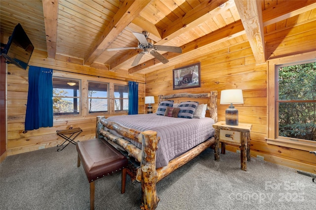 339 Tsalagi Trl, Maggie Valley, NC 28751 - carpeted bedroom featuring wood walls, multiple windows, wooden ceiling with exposed beams, and ceiling fan