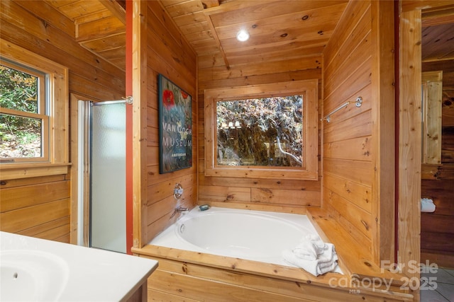 339 Tsalagi Trl, Maggie Valley, NC 28751 - full bathroom featuring wooden walls, vanity, wood ceiling, a garden tub, and a shower stall