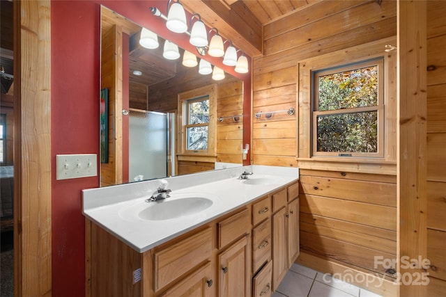 339 Tsalagi Trl, Maggie Valley, NC 28751 - bathroom featuring double vanity, wooden walls, a shower stall, tile patterned flooring, and wood ceiling