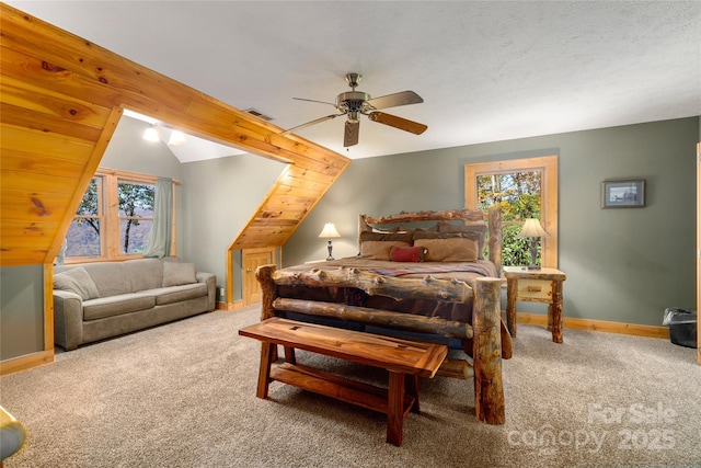 339 Tsalagi Trl, Maggie Valley, NC 28751 - bedroom with carpet flooring, multiple windows, baseboards, lofted ceiling, and a ceiling fan