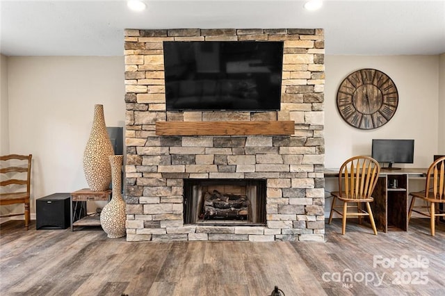 137 Weaver Ct, Lake Lure, NC 28746 - detailed view of a stone fireplace, wood finished floors, and recessed lighting