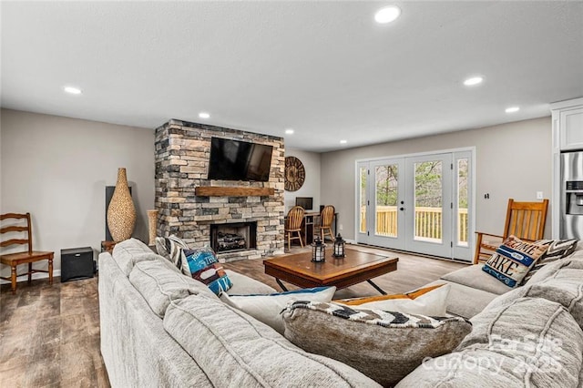 137 Weaver Ct, Lake Lure, NC 28746 - living room featuring wood finished floors, recessed lighting, a fireplace, french doors, and baseboards