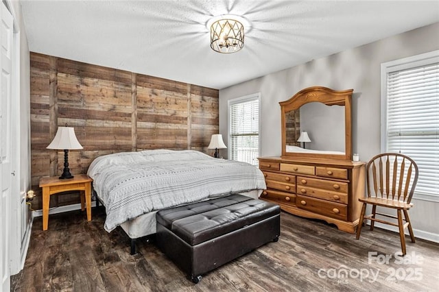 137 Weaver Ct, Lake Lure, NC 28746 - bedroom featuring wood finished floors, wooden walls, and baseboards