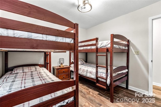 137 Weaver Ct, Lake Lure, NC 28746 - bedroom with wood finished floors and baseboards