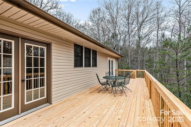 137 Weaver Ct, Lake Lure, NC 28746 - wooden deck with outdoor dining space and french doors