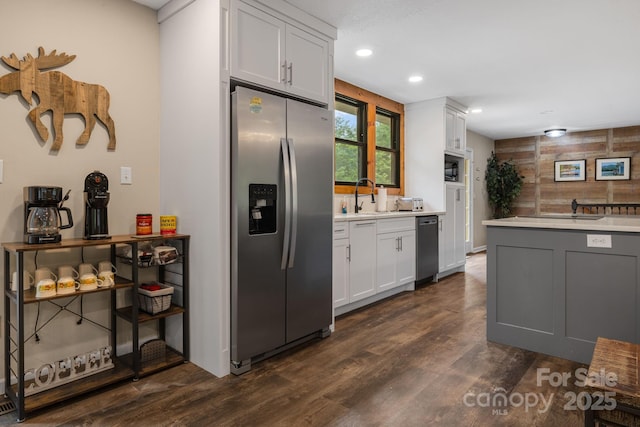 137 Weaver Ct, Lake Lure, NC 28746 - kitchen featuring stainless steel appliances, light countertops, dark wood finished floors, recessed lighting, and white cabinets