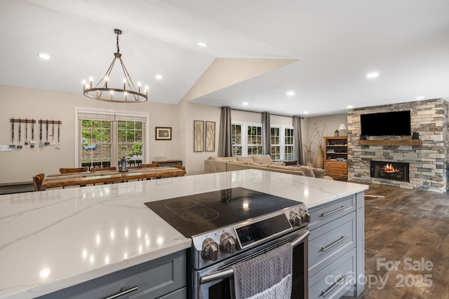 137 Weaver Ct, Lake Lure, NC 28746 - kitchen with stainless steel range with electric cooktop, gray cabinetry, open floor plan, a chandelier, and recessed lighting