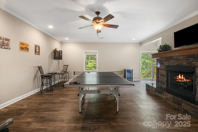 137 Weaver Ct, Lake Lure, NC 28746 - recreation room with plenty of natural light, wine cooler, crown molding, recessed lighting, and a stone fireplace