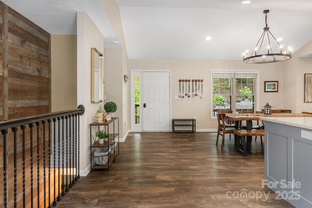 137 Weaver Ct, Lake Lure, NC 28746 - entrance foyer featuring a chandelier, dark wood-style floors, vaulted ceiling, and recessed lighting