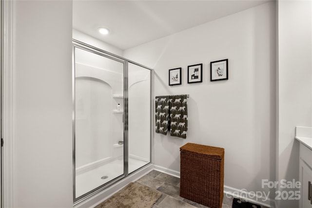 461 Misty Law Ln, Clover, SC 29710 - full bathroom featuring a shower stall, baseboards, vanity, and stone finish floors