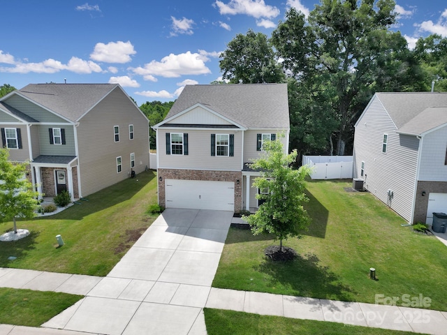 461 Misty Law Ln, Clover, SC 29710 - traditional-style house featuring brick siding, concrete driveway, and an attached garage