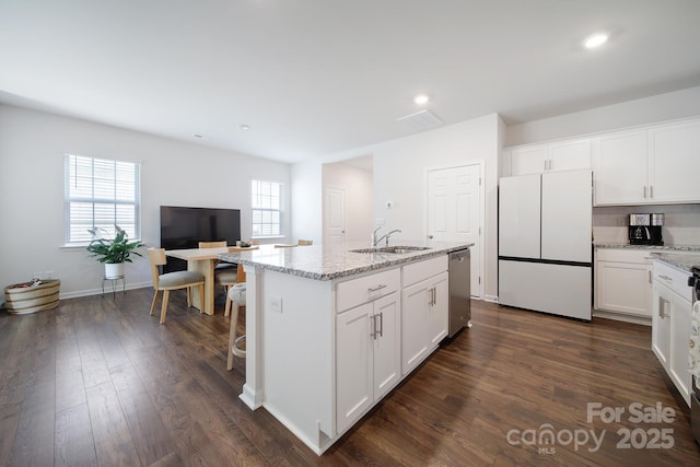 461 Misty Law Ln, Clover, SC 29710 - kitchen featuring freestanding refrigerator, stainless steel dishwasher, white cabinets, an island with sink, and recessed lighting