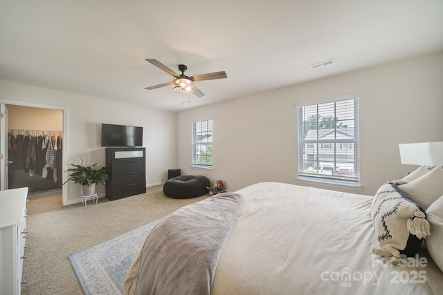 461 Misty Law Ln, Clover, SC 29710 - carpeted bedroom featuring a walk in closet, ceiling fan, and a closet