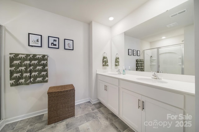 461 Misty Law Ln, Clover, SC 29710 - bathroom with double vanity, a shower stall, stone finish flooring, and recessed lighting