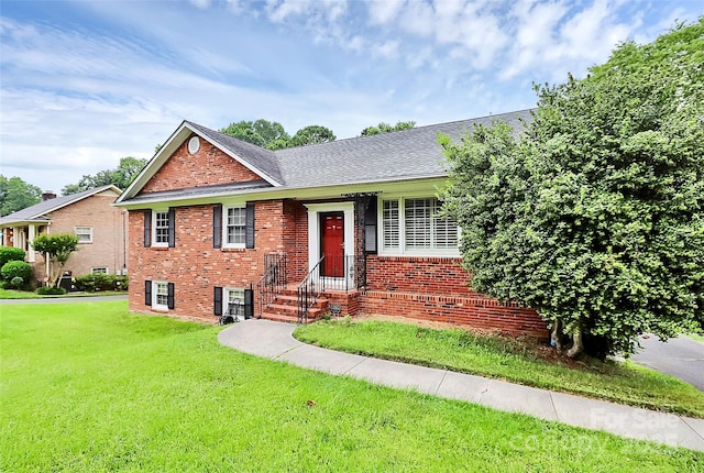 6908 Lancer Dr, Charlotte, NC 28226 - view of front facade featuring brick siding and a front yard