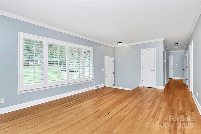 6908 Lancer Dr, Charlotte, NC 28226 - unfurnished room featuring light wood finished floors, crown molding, baseboards, and attic access