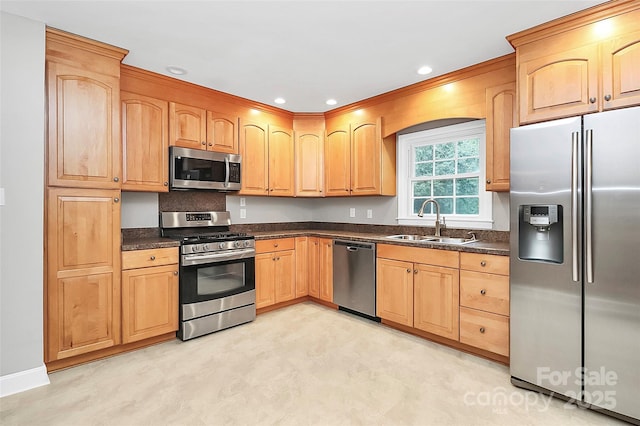 6908 Lancer Dr, Charlotte, NC 28226 - kitchen featuring appliances with stainless steel finishes, a sink, recessed lighting, and light brown cabinetry