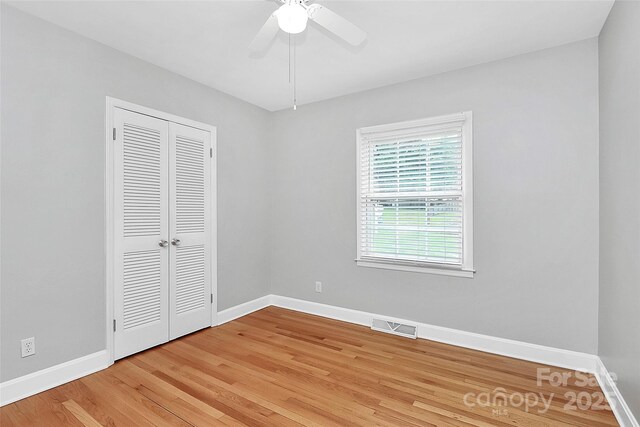 6908 Lancer Dr, Charlotte, NC 28226 - unfurnished bedroom with baseboards, light wood finished floors, a closet, and a ceiling fan