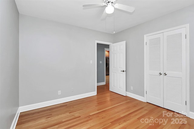 6908 Lancer Dr, Charlotte, NC 28226 - unfurnished bedroom with light wood finished floors, baseboards, a closet, and ceiling fan