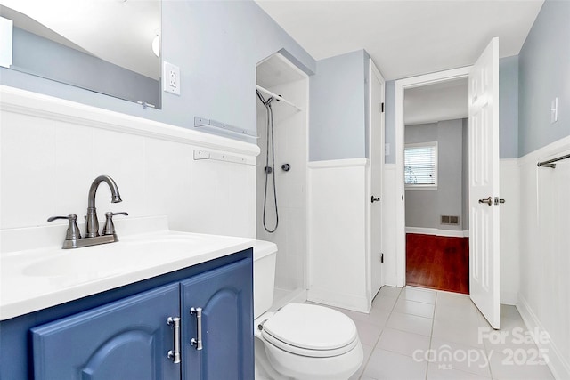 6908 Lancer Dr, Charlotte, NC 28226 - bathroom featuring a shower, vanity, tile patterned flooring, and toilet