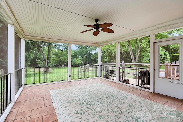 6908 Lancer Dr, Charlotte, NC 28226 - unfurnished sunroom with ceiling fan, plenty of natural light, and view of wooded area