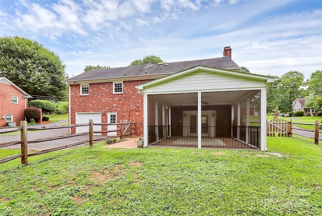 6908 Lancer Dr, Charlotte, NC 28226 - back of property featuring a sunroom, brick siding, a chimney, and an attached garage