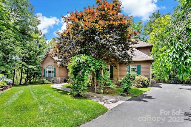 65 Timber Park Dr, Black Mountain, NC 28711 - obstructed view of property with a front lawn, roof with shingles, and stone siding