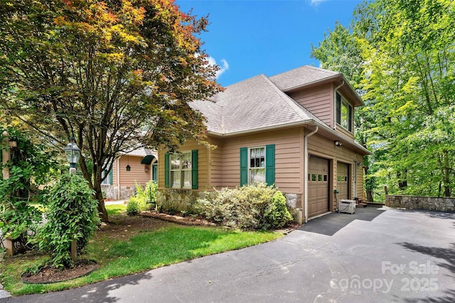 65 Timber Park Dr, Black Mountain, NC 28711 - view of front of house with asphalt driveway, a shingled roof, and stone siding