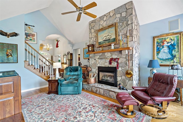 65 Timber Park Dr, Black Mountain, NC 28711 - living room featuring stairway, a ceiling fan, wood finished floors, a fireplace, and high vaulted ceiling