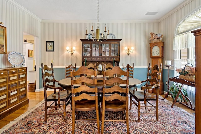 65 Timber Park Dr, Black Mountain, NC 28711 - dining space featuring a chandelier, ornamental molding, and wood finished floors
