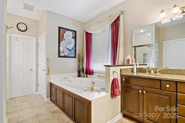 65 Timber Park Dr, Black Mountain, NC 28711 - bathroom featuring vanity, a bath, tile patterned floors, and a stall shower