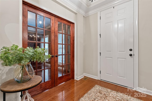 10620 Euclid Ave NW, Concord, NC 28027 - foyer entrance featuring wood finished floors, french doors, baseboards, and ornamental molding