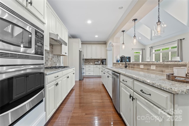 10620 Euclid Ave NW, Concord, NC 28027 - kitchen featuring appliances with stainless steel finishes, a sink, white cabinetry, backsplash, and recessed lighting