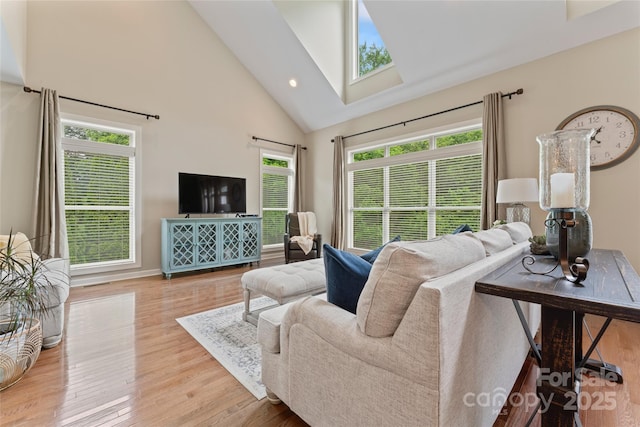 10620 Euclid Ave NW, Concord, NC 28027 - living area with a skylight, high vaulted ceiling, wood finished floors, baseboards, and recessed lighting