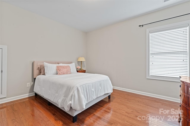10620 Euclid Ave NW, Concord, NC 28027 - bedroom with baseboards and light wood finished floors
