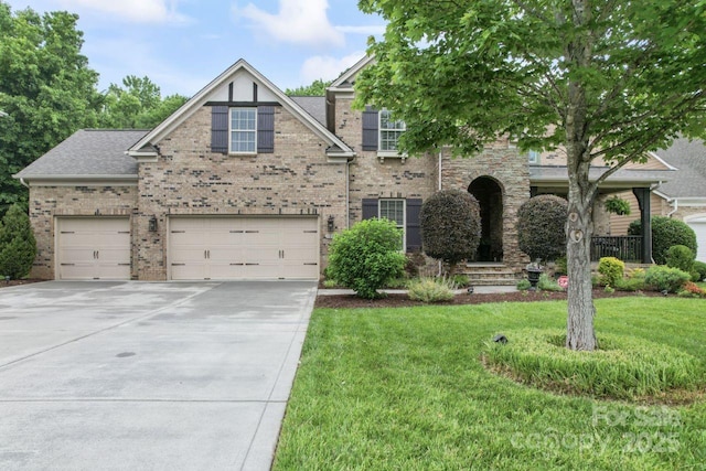 10620 Euclid Ave NW, Concord, NC 28027 - view of front of home featuring driveway, a front lawn, brick siding, and a garage