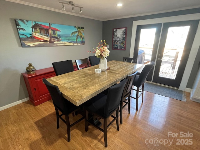 132 Marina Ln, Mooresville, NC 28117 - dining room with light wood-type flooring, crown molding, french doors, and baseboards