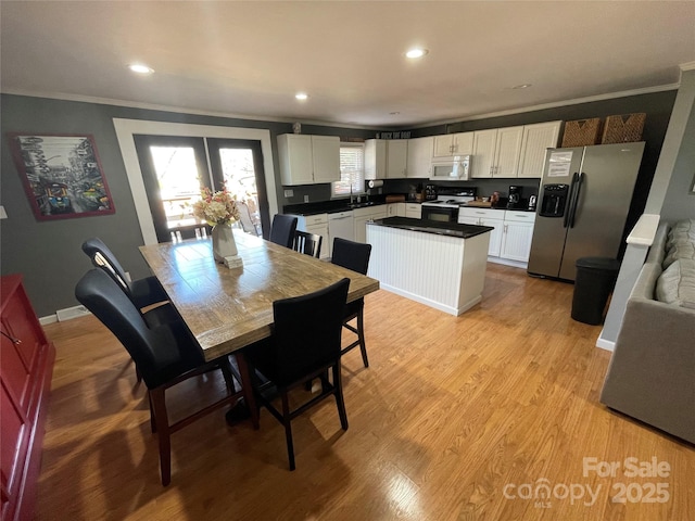 132 Marina Ln, Mooresville, NC 28117 - dining room with ornamental molding, light wood finished floors, recessed lighting, and baseboards