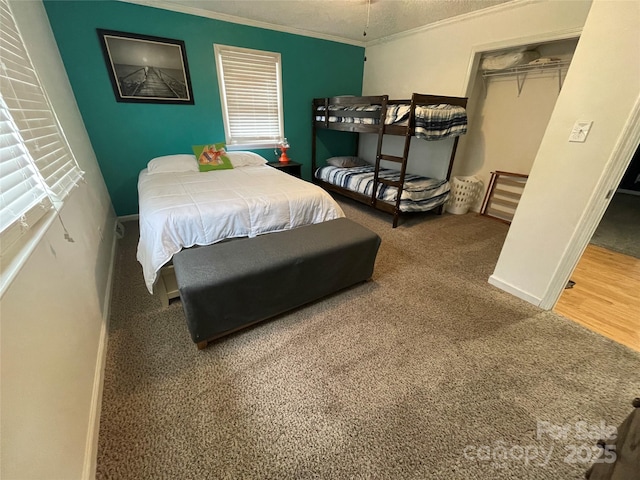 132 Marina Ln, Mooresville, NC 28117 - bedroom with ornamental molding, baseboards, carpet, and a closet