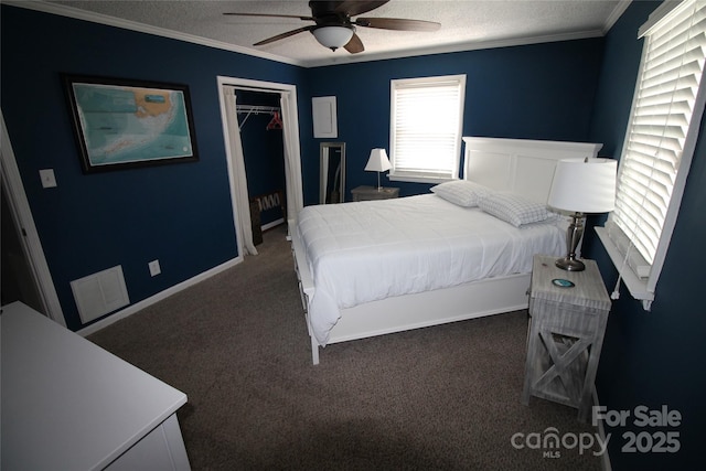 132 Marina Ln, Mooresville, NC 28117 - carpeted bedroom featuring ornamental molding, a closet, a textured ceiling, and ceiling fan