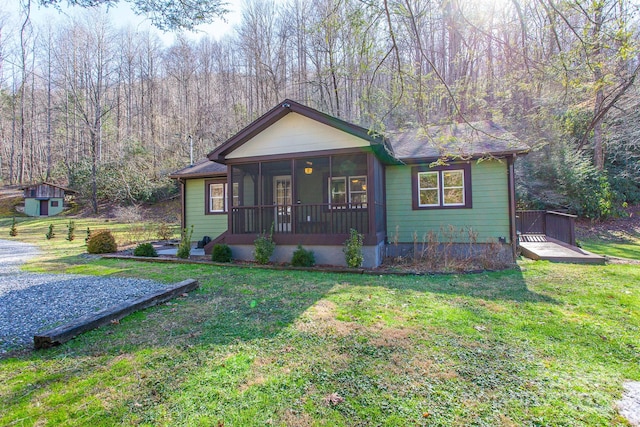 7150 Yellow Creek Rd, Robbinsville, NC 28771 - bungalow-style home with a sunroom and a front yard